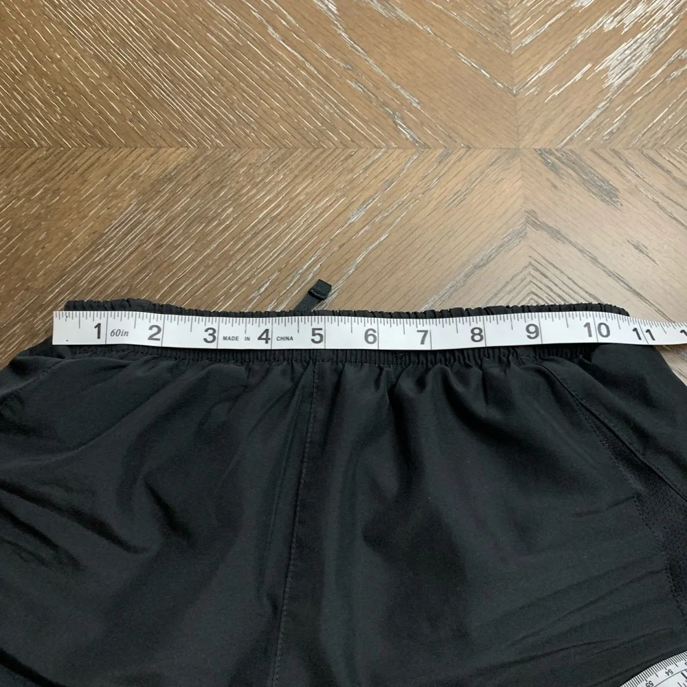 Nike black with white trim athletic shorts Size M